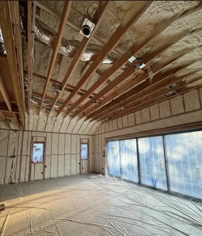 Interior walls and ceiling insulated with spray foam during new construction in Crystal Lake